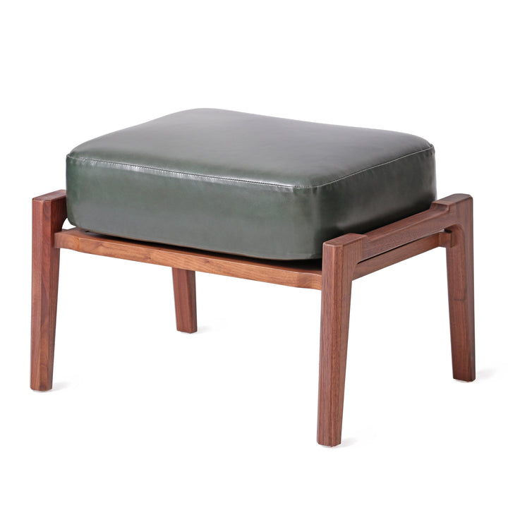 Modern ottoman with natural walnut wooden frame and dark green leather cushion, ideal for complementing lounge chairs in contemporary home or office decor.